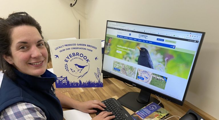 lady on a computer one of our Head ladies hard at work in The Eyebrook Wild Bird Feeds Office