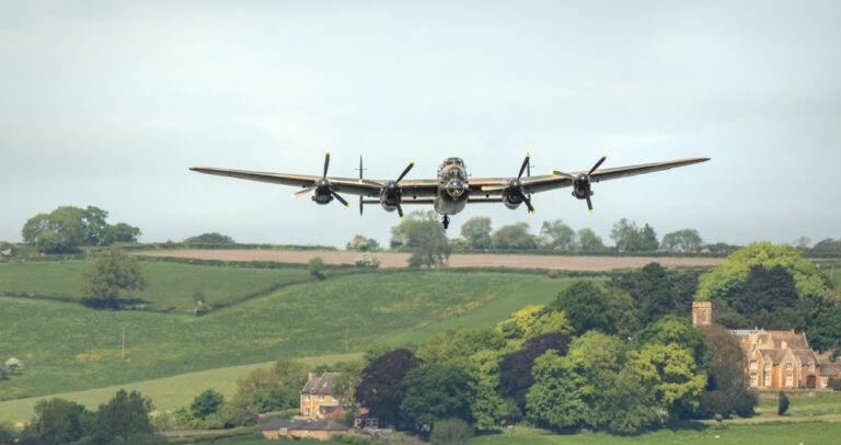 Lancaster flying over the Eyebrook Resivoir